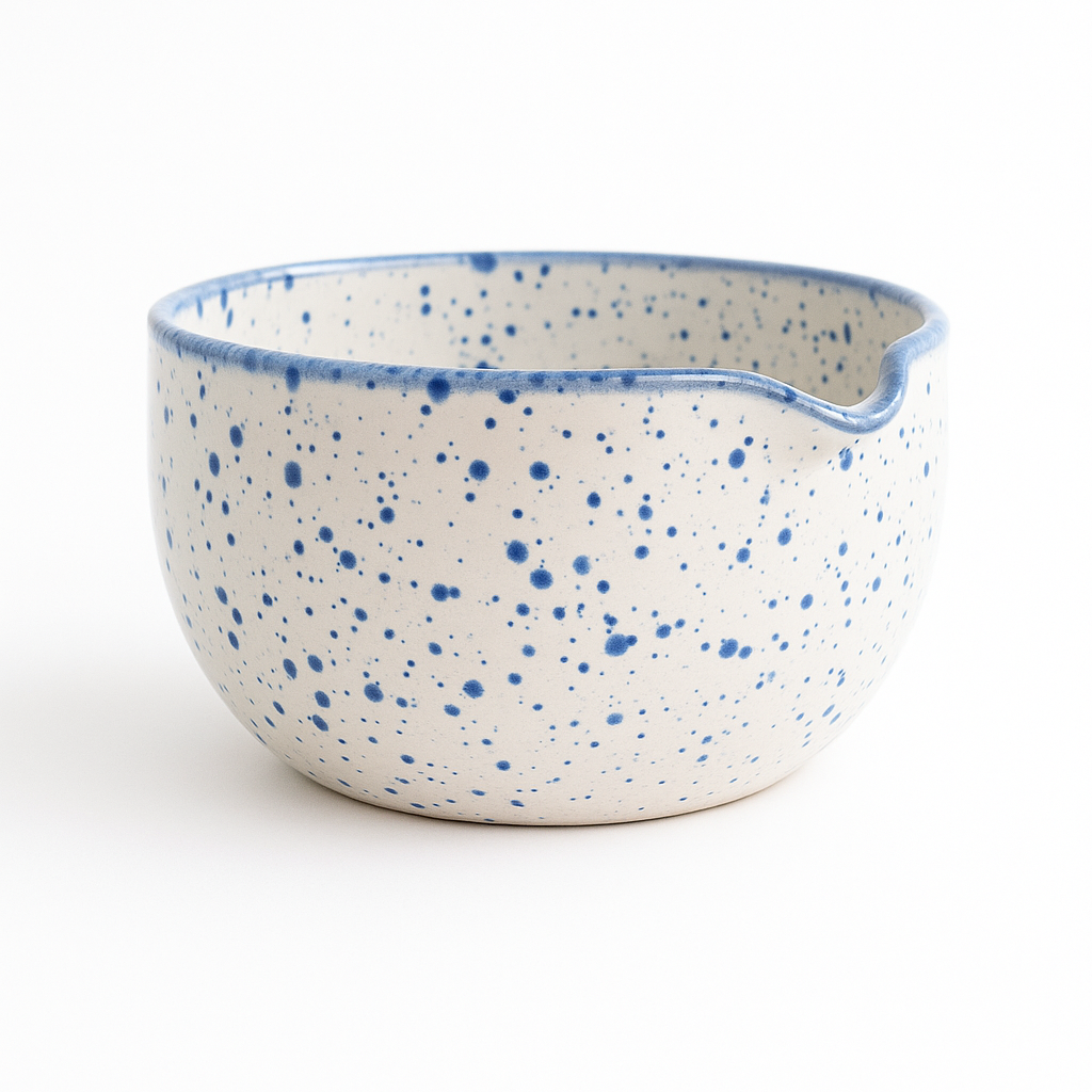 Handcrafted ceramic matcha bowl by MugMug for Thea9, featuring artisanal blue speckle design and a pouring spout for effortless ceremony-grade tea preparation.